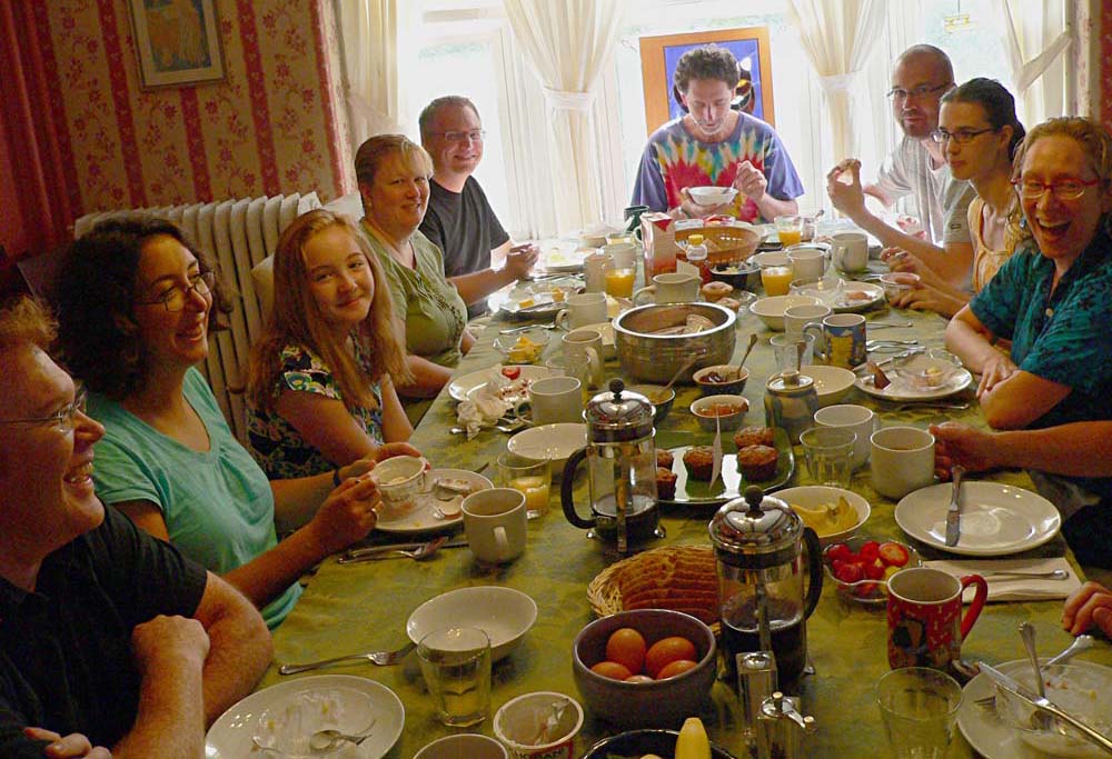 guests enjoying breakfast around large table